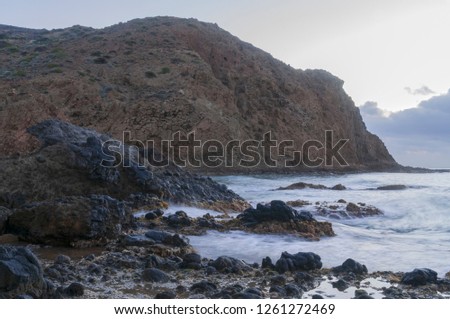 Waves breaking in the rocks of the coast
