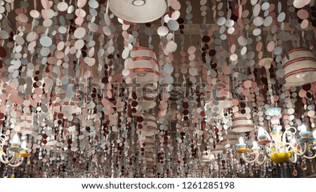 Texture abstract Background for Christmas card Festive decoration ceiling paper garlands balls and chandeliers design Christmas 2019 candy