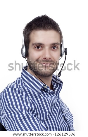 Handsome male call center operator smiling over white background