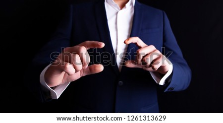 businessman finger screen to tell