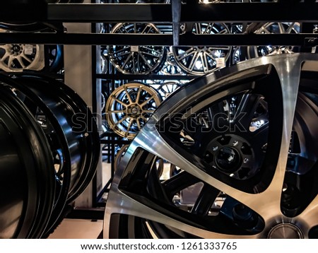 Close up of magnesium alloy car wheels display on shelf store.