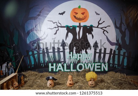 Halloween Pumpkin . Halloween pumpkin grinning in the most evil fashion . Spooky Halloween Jack o Lantern . Pumpkin on dry straw in autumn on a background . In preparation for Halloween