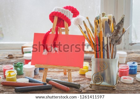 Christmas composition with objects for drawing lessons at school: brushes, paints and other things for creativity