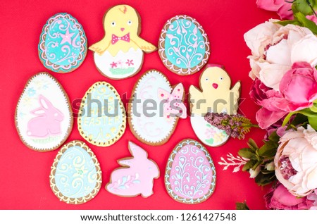Easter homemade gingerbread on red background. Studio Photo