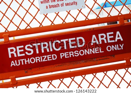 A security sign outside a restricted area Royalty-Free Stock Photo #126143222