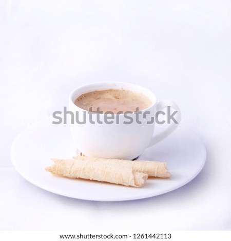 warm chocolate drink and a piece of pastry