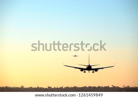 Commercial passenger airline jet in air traveling to a new destination Royalty-Free Stock Photo #1261459849