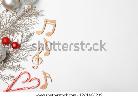 Composition with wooden music notes and space for text on white background, top view