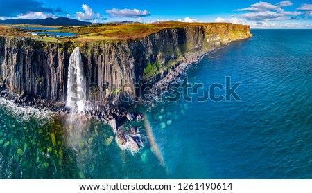 Aerial view of the dramatic coastline at the cliffs by Staffin with the famous Kilt Rock waterfall - Isle of Skye - Scotland. Royalty-Free Stock Photo #1261490614