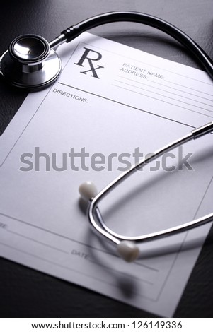 Stethoscope and patient list on black