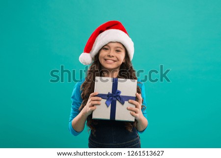 Happy winter holidays. Small girl. Little girl child in santa hat. New year party. Santa claus kid. Present for Xmas. Childhood. Christmas shopping. Christmas hope yours is all about the merry.