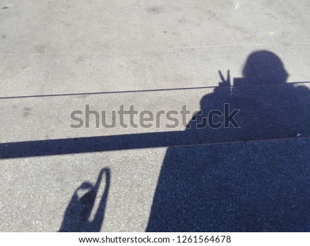 Human shadow on concrete street.