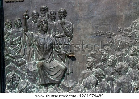 RELIEF OF JESUS CHRIST TEACHING A CROWD OF PEOPLE ON A METAL SURFACE