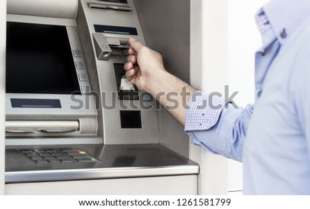 Man using a ATM 