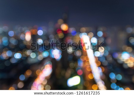 Blurred image for background of  modern business city with bokeh and colorful lights of traffic in the city. 