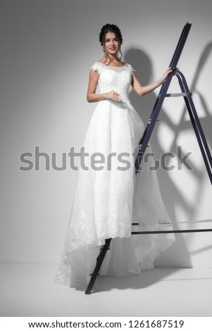 Young model in white luxury wedding dress