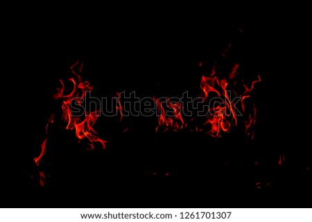 Fire flames on Abstract black background, Burning red hot sparks rise from large fire in, Fiery orange glowing