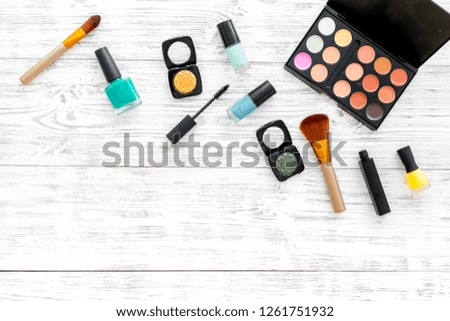 female desk with decorative cosmetics for make up white wooden background top view mockup