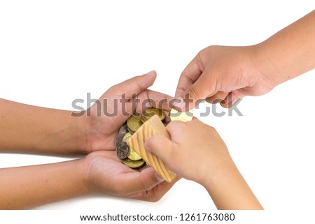 Human hand giving golden coin to another hand on isolated white background.