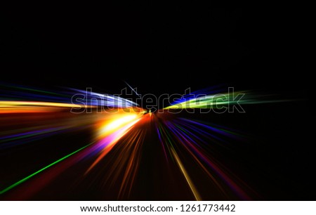 Car moving on highway against dark night, photograph is taken with long exposure.