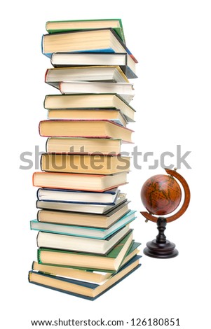 large stack of different books and old globe isolated on white background