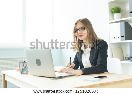 Business, web design and graphic art concept - Beautiful smiling woman in glasses using mouse pan sketch device