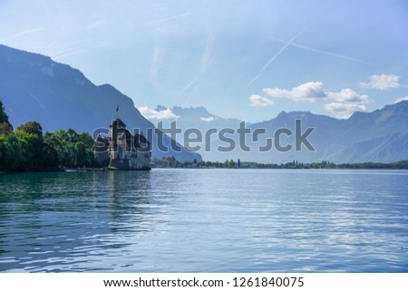 Chateau de Chillon Castle and mountains. It is a medieval fortress on Lake Geneva (Lac Leman), near Montreux, canton of Vaud, Switzerland