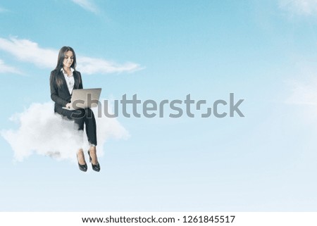 Attractive young businesswoman using laptop while sitting on cloud. Sky background. Work freedom and freelance concept 