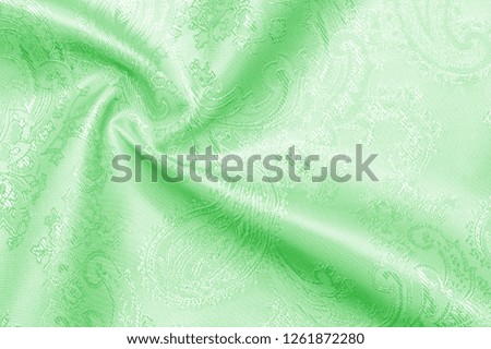 Texture background Fabric silk green Slim and light, add it to your design, inspired by the runway. It has a smooth, clear hand and a slightly transparent opacity, allowing the lining to be optional.