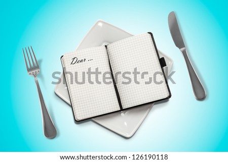 notebook on a plate and blue background.