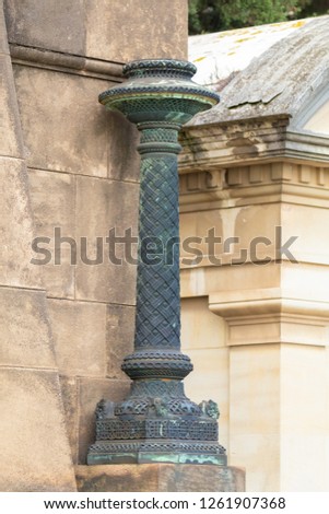 elements of architectural decorations of buildings, columns, pommel and patterns, on the streets in Catalonia, public places.