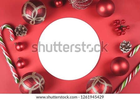 Beautiful Christmas decoration accessories on red background with copy space. Celebration concept.