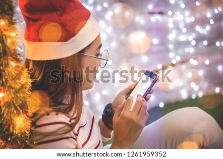 Close-up photos of a woman's hand using a smartphone at night on a shopping street in the city. Search or social networking concept. Hipster Prints SMS Text Messages to His Friends - Pictures and Idea