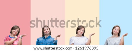 Collage of down syndrome woman over colorful stripes isolated background smiling cheerful presenting and pointing with palm of hand looking at the camera.