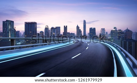 Curvy flyover highway moving forward road with Bangkok cityscape evening scene view . motion blur effect apply Royalty-Free Stock Photo #1261979929