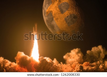 Rocket launch to moon as a Bitcoin price increase concept. The elements of this image furnished by NASA Royalty-Free Stock Photo #1262008330