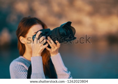 Woman photographer in nature                  