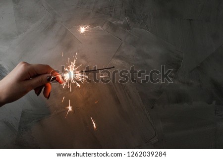 Amazing sparklers in female hands