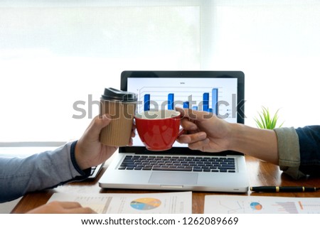 businessman work with friend on the table with computer laptop calulator ,working data analyses for business plan and marketing.
