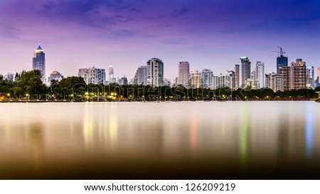 Stock Photo: City downtown at night with reflection of skyline