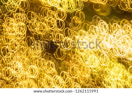 Abstract bright yellow lights for background. Decorative lights. Long exposure lights.