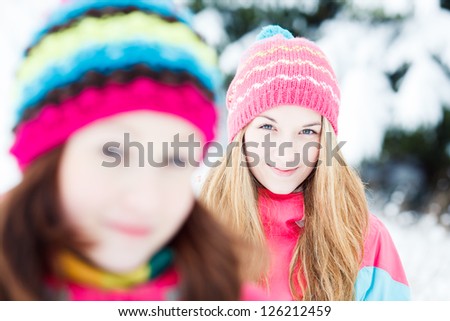 Two Young Beautiful Girls in winter outdoors