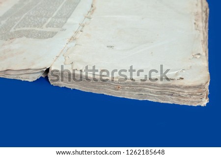 Old book cover, vintage texture, isolated on blue background. Old Jewish Talmud in Yiddish with Bible.