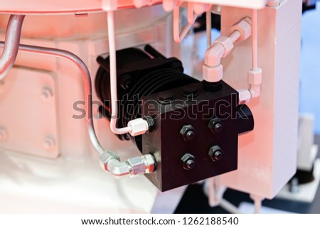 Focus on detail of machine for industry; note shallow depth of field