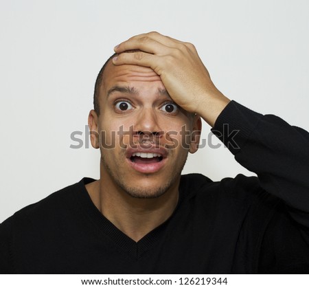 Mixed race male looking in shock or panic Royalty-Free Stock Photo #126219344