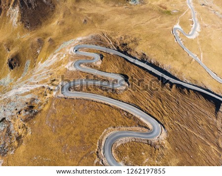 spiral transalpina road in mountains from dron