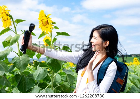 Asian young woman visit sunflower field - Image