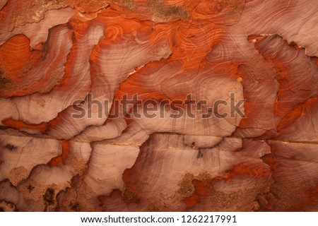 The multi-colored exposed sandstone rock and mineral layers in the ancient tombs of Petra, Jordan.Sandstone pattern,geological texture in Petra,Jordan.Petra is an Unesco World Heritage site.red stone Royalty-Free Stock Photo #1262217991