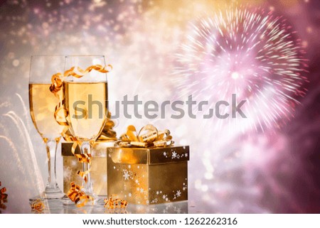 Champagne glasses on sparkling holiday background
