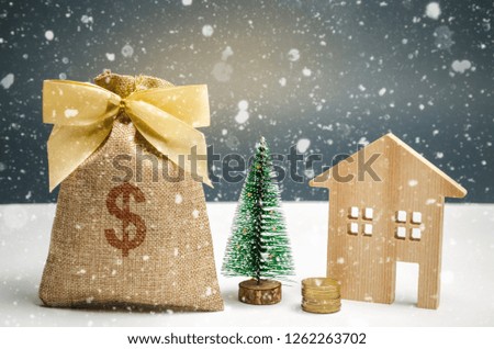 Wooden house and Christmas tree and a bag of money. Christmas Sale of Real Estate. New Year discounts for buying house. Purchase apartments at a low price. Winter resort and vacation. Dollar sign